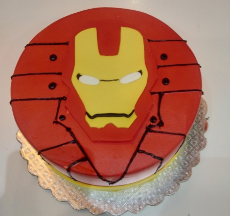 Vani's Creative Bakers and Events - Iron man theme inspired cake... hand  cutted iron man face and arc reactor on the cake... no moulds used on it...  #ironman #ironman2 #ironman3 #ironmanlovers #avengers #